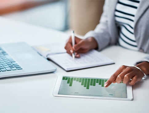 Financial professional showing clients their portfolio on a tablet